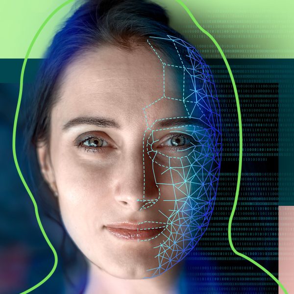 Cropped visual of the face of a female illuminated with the reflection of technological symbols.