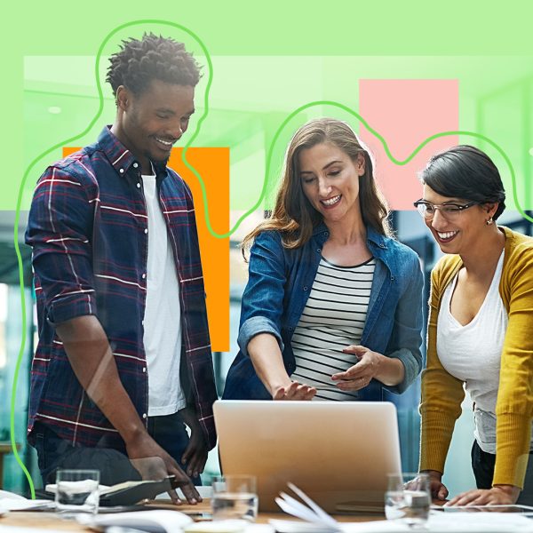 Diverse group of people talking around a laptop