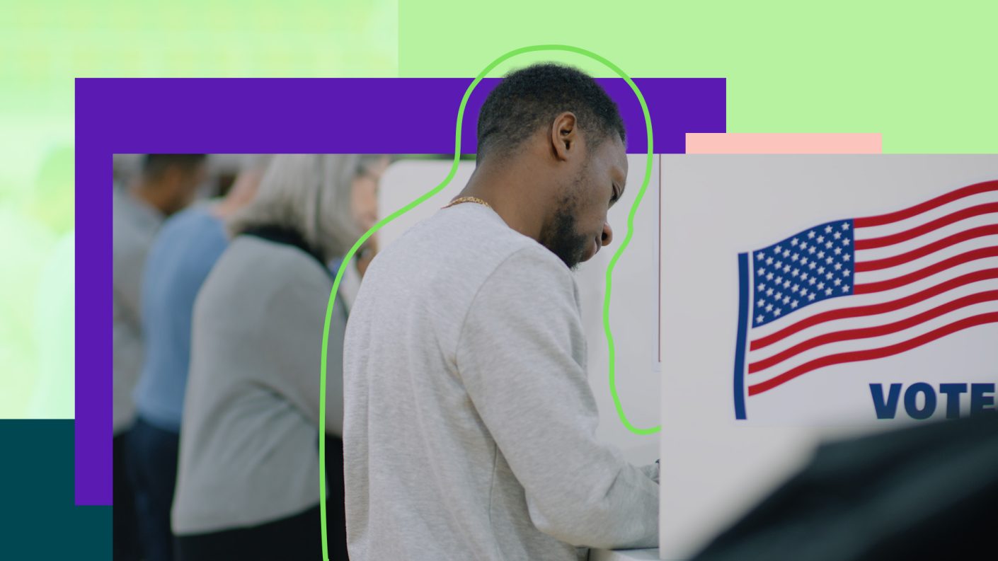 Male in a voting booth, voting for the US elections.