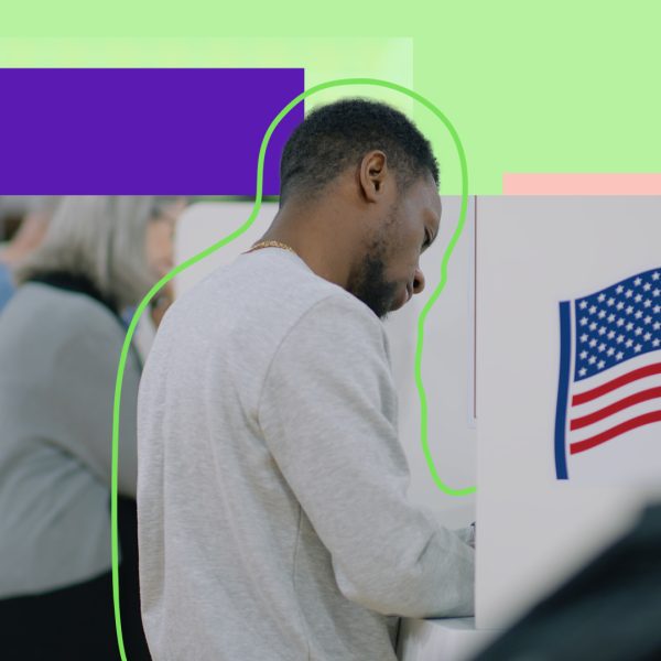 Male in a voting booth, voting for the US elections.